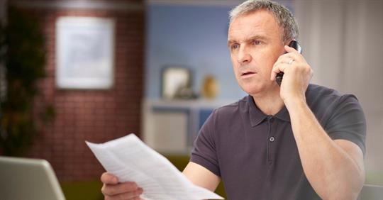 Man speaking to a creditor